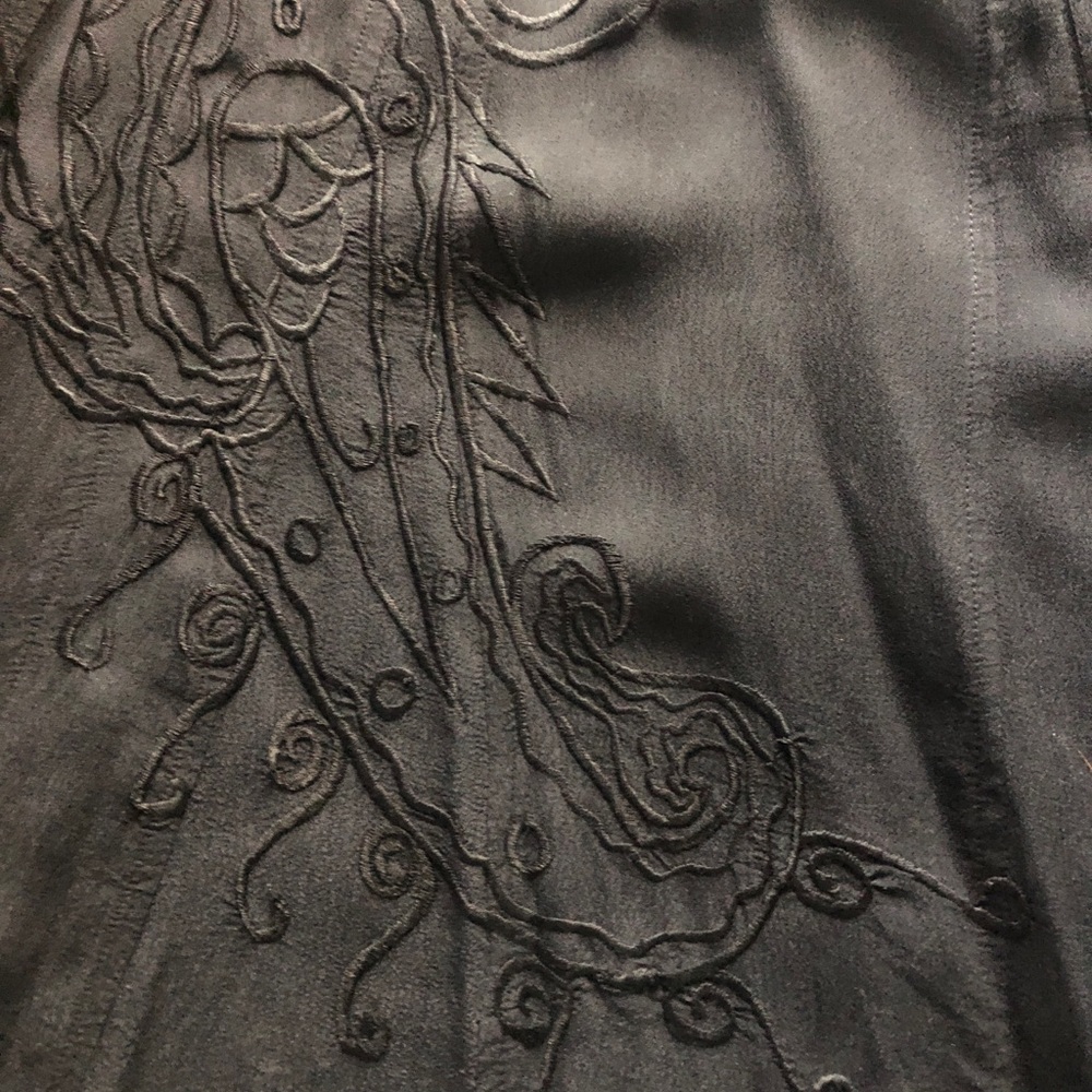 Black long skirt with black embroidered pattern